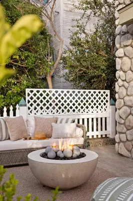 a fire pit with candles in the middle of a patio at Nantucket-Style - Steps to Beach Rooftop Deck Ocean Views in San Diego