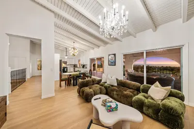 a living room with a couch and a table at # Marbella Lane - Home with Ocean & Golf Course Views in San Clemente