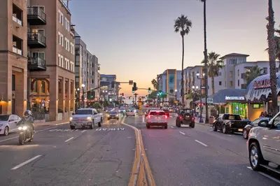 a busy city street filled with lots of traffic at King Suite - Steps to Beach & Close to Pier in Oceanside