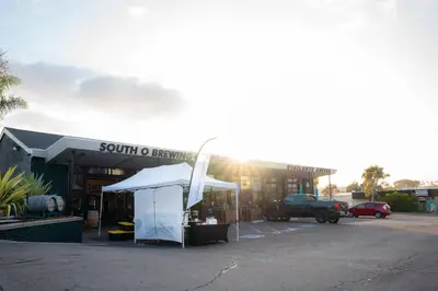 a tent in front of a building with a truck at King Suite - Steps to Beach & Close to Pier in Oceanside