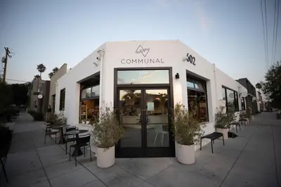 a restaurant with tables and chairs in front of it at Steps to Beach & Close to Restaurants and Shops in Oceanside