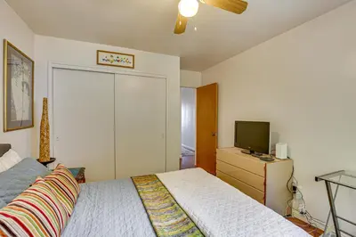 a bedroom with a bed and a flat screen tv at Mt Nebo Oasis in La Mesa with Wraparound Deck in La Mesa
