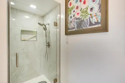 a shower in a bathroom with a painting on the wall at Mt Nebo Oasis in La Mesa with Wraparound Deck in La Mesa