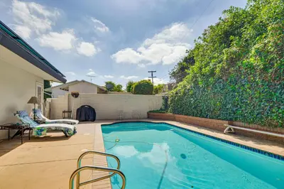 a swimming pool in the backyard of a house at Mt Nebo Oasis in La Mesa with Wraparound Deck in La Mesa