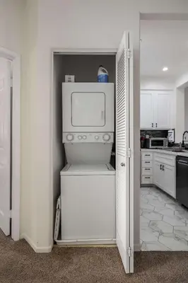 a kitchen with a white refrigerator with a microwave at Redecorated - Serene- Legoland- Family-Friendly in Carlsbad