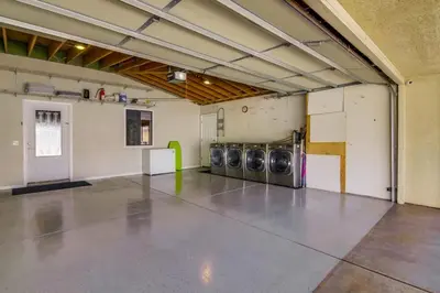 a garage with three washing machines in it at PACIFIC BEACH ESTATE water view in San Diego