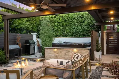 an outdoor patio with a fireplace and a grill at Luxury La Jolla Home with Jacuzzi in San Diego