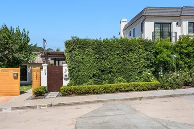 a hedge in front of a house at Luxury La Jolla Home with Jacuzzi in San Diego