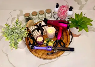 a table topped with a basket with a bunch of items at Majestic Lux Home with Heated Pool and Spa! in San Diego