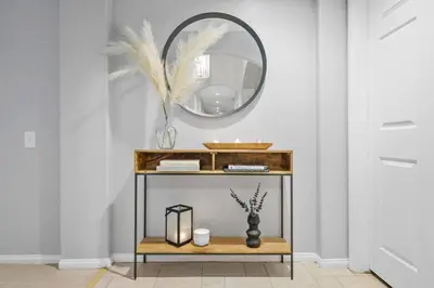 a console table with a mirror in a room at Massive 7BR Stunning MTN View Zen Retreat Pool and Spa in Ramona