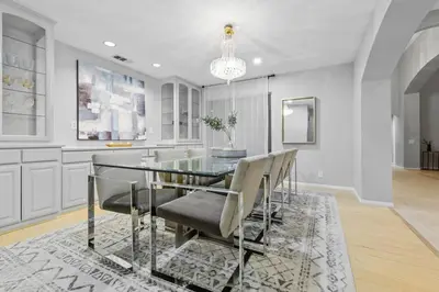 a dining room with a glass table and chairs at Massive 7BR Stunning MTN View Zen Retreat Pool and Spa in Ramona