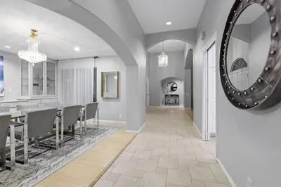 a dining room with a table and a mirror at Massive 7BR Stunning MTN View Zen Retreat Pool and Spa in Ramona