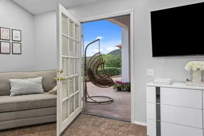 a living room with a couch and a sliding glass door at Massive 7BR Stunning MTN View Zen Retreat Pool and Spa in Ramona