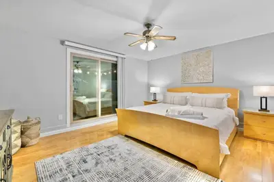 a bedroom with a bed and a ceiling fan at Massive 5BR Resort Style Retreat with Heated Pool in San Diego