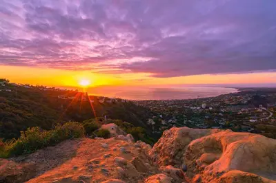 a sunset from the top of a mountain at Massive 5BR Resort Style Retreat with Heated Pool in San Diego