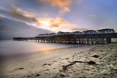 a pier on the beach with houses on it at Massive 5BR Resort Style Retreat with Heated Pool in San Diego