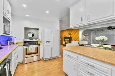 a kitchen with white cabinets and a counter top at Massive 5BR Resort Style Retreat with Heated Pool in San Diego
