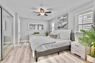 a bedroom with a bed and a ceiling fan at MB Contemporary 14 Guests by Sand AC plus Garage in San Diego