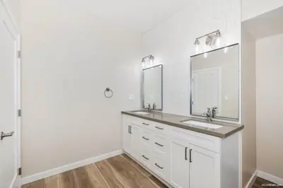a white bathroom with a sink and a mirror at 1 Block to Sand Stylish 3BR Contemporary Home in San Diego