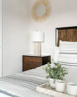 a bedroom with a bed with a mirror and plants on it at 1 Block to Sand Stylish 3BR Contemporary Home in San Diego