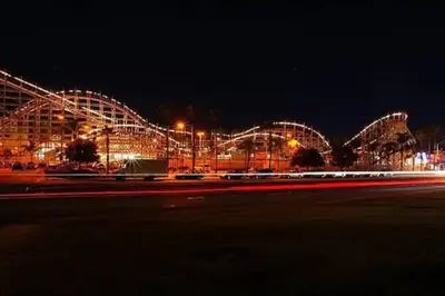 a large building with lights at night at 1 Block to the Sand Stylish & Spacious Studio! in San Diego