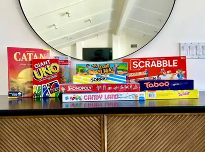 a pile of snacks on a counter in front of a mirror at PB 3BR Beach Retreat Hot Tub Mini Golf in San Diego