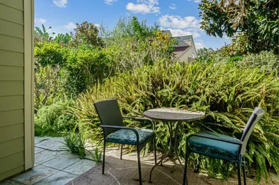 a patio with two chairs and a table at Encinitas Paradise | Seabluffe Gated Community w/ Beach Access in Encinitas