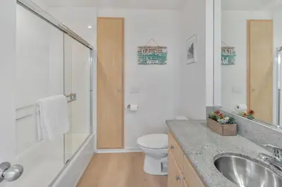 a bathroom with a sink and a toilet and a shower at Oceanside Harbor Getaway | Steps to Sand, Shops & Restaurants in Oceanside