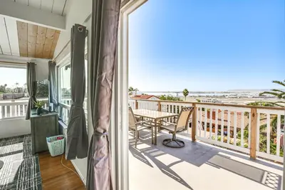 a balcony with a table and a view of the ocean at 3 Mi to Balboa Park Water-View Condo with Balcony in San Diego