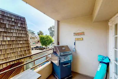 a grill on the balcony of a building at Stroll to Shore and Mission Blvd Dog-Friendly Home in San Diego