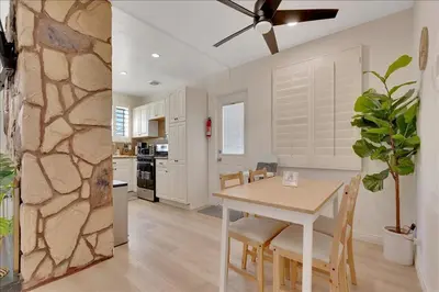 a kitchen and dining room with a table and chairs at Double Flamingo HotTub BBQ Game Room Self Check-in in San Diego