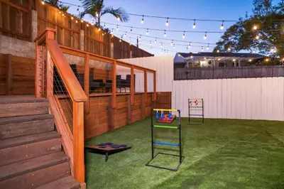 a playground with a play equipment in a yard at Newly Built Coastal Home with Yard in San Diego