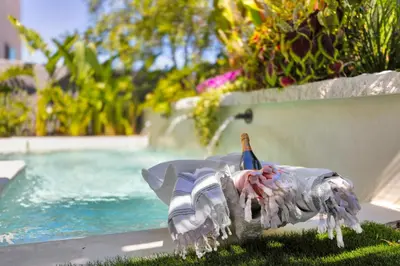a bird statue sitting on the grass next to a pool at # Marbella Lane - Stylish Dream Home in RMV with Pool in Mission Viejo