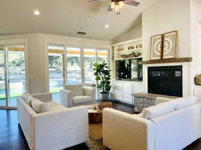 a living room with white furniture and a fireplace at Getaway Retreat Close to Temecula San Diego LA in Murrieta