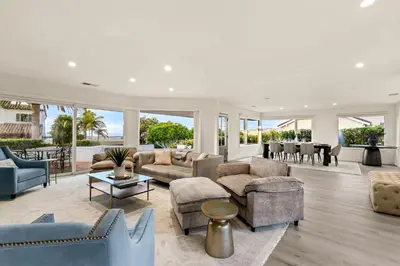 a living room with couches and chairs at Pacific Perfection - Ocean Views Jacuzzi Walk to Beach and Dining in San Diego
