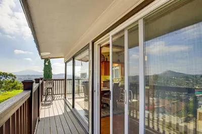 a balcony of a house with a view of the mountains at Amazing Views with massive pool Total Oasis in La Mesa