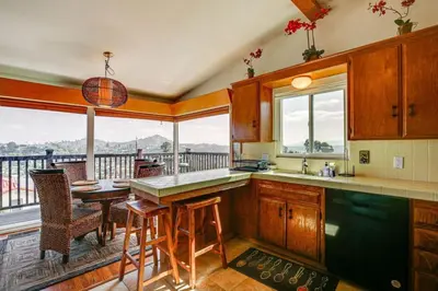 a kitchen with a balcony with a table and chairs at Amazing Views with massive pool Total Oasis in La Mesa