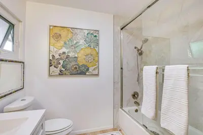 a bathroom with a shower and a toilet and a sink at Amazing Views with massive pool Total Oasis in La Mesa