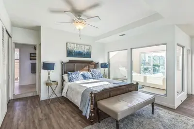 a bedroom with a bed and a ceiling fan at Massive 5 bedroom overlooking the water-STR14-0105 in Dana Point