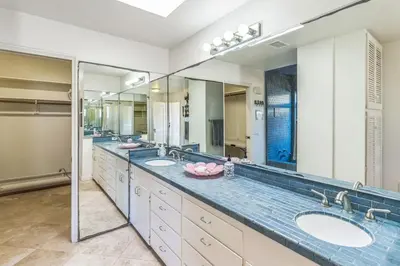 a bathroom with three sinks and two mirrors at Massive 5 bedroom overlooking the water-STR14-0105 in Dana Point