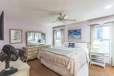 a bedroom with a bed and a ceiling fan at Massive 5 bedroom overlooking the water-STR14-0105 in Dana Point