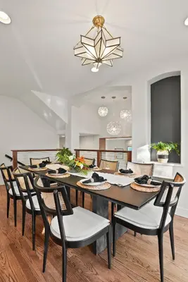a dining room with a large wooden table and chairs at Village Vistas - Walk to Beach and LJ Village, AC, Spa in San Diego
