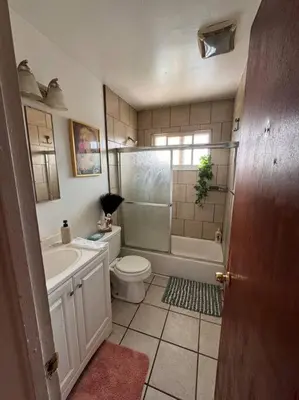 a bathroom with a toilet and a sink and a shower at Boho Chic Loft Little Italy Walk Everywhere in San Diego