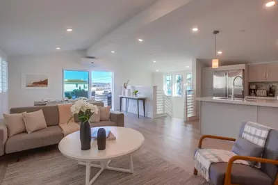 a living room with a couch and a table at Bayside Cove 8 in San Diego