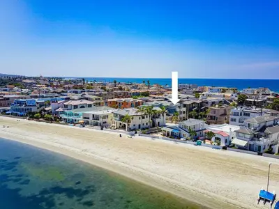 an aerial view of a beach with houses and the ocean at Bayside Cove 8 in San Diego