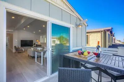 a patio with a table with fruit on it at Bayside Cove 8 in San Diego