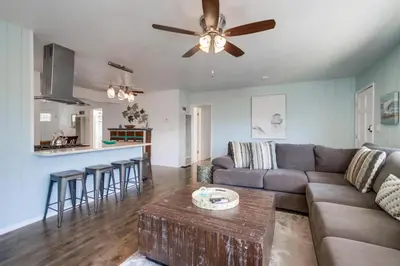 a living room with a couch and a table at Tidal Wave 2 WINTER SPECIAL! in San Diego