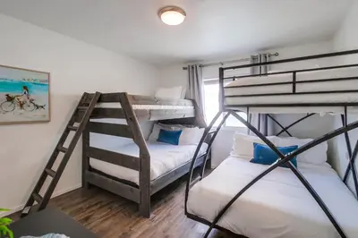 a room with two bunk beds and a window at Tidal Wave 2 WINTER SPECIAL! in San Diego
