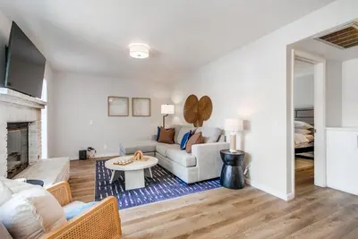 a living room with a couch and a table at Local Gem 1 in San Diego