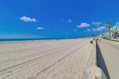 a view of a beach with people walking on it at Ocean & Bay in San Diego